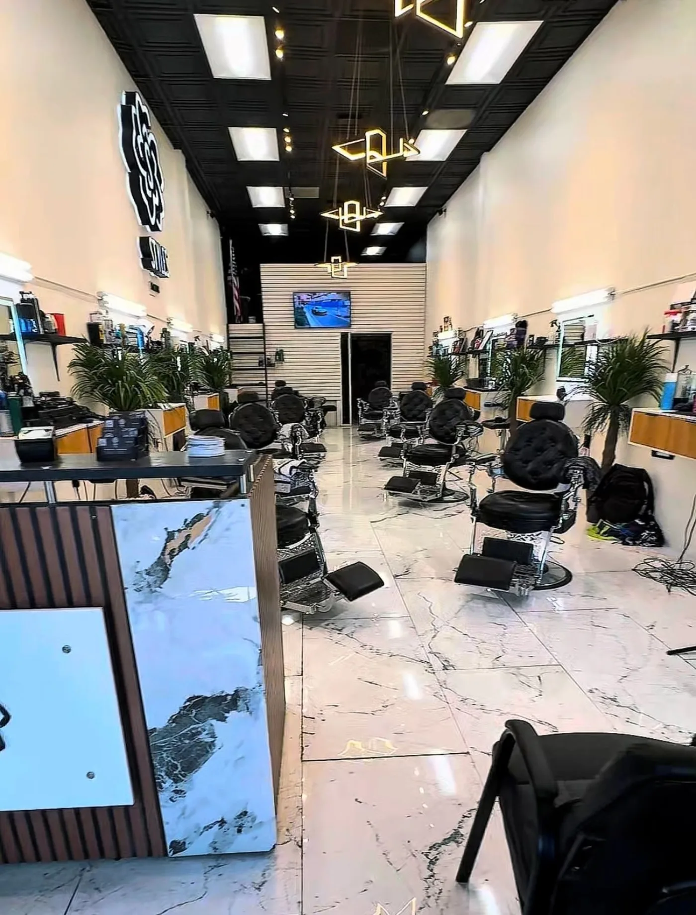 The bright marble interior of Styles Barber Lounge